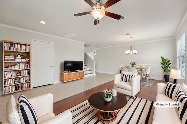 100 Blanco Woods Blvd, Elgin, TX 78621 - living area with wood finished floors, ornamental molding, a ceiling fan, a chandelier, and recessed lighting
