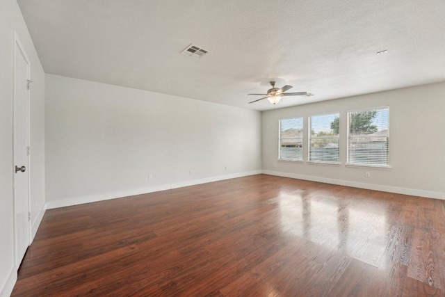 100 Blanco Woods Blvd, Elgin, TX 78621 - spare room featuring a ceiling fan, wood finished floors, baseboards, and a textured ceiling