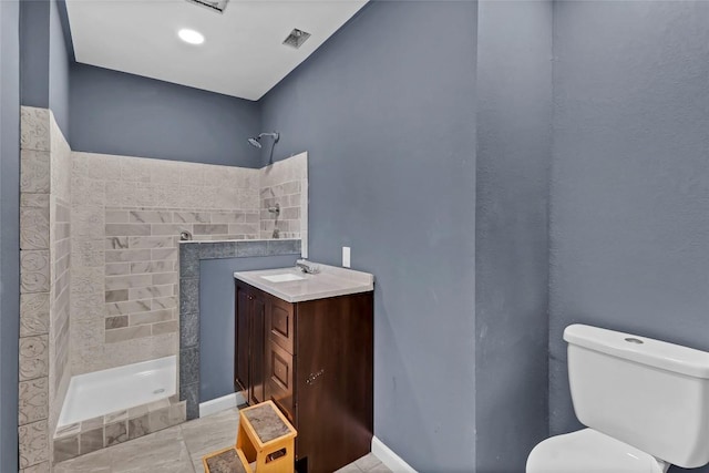 122 W Sierra Cir, San Marcos, TX 78666 - bathroom featuring tiled shower, toilet, a fireplace, tile patterned floors, and vanity