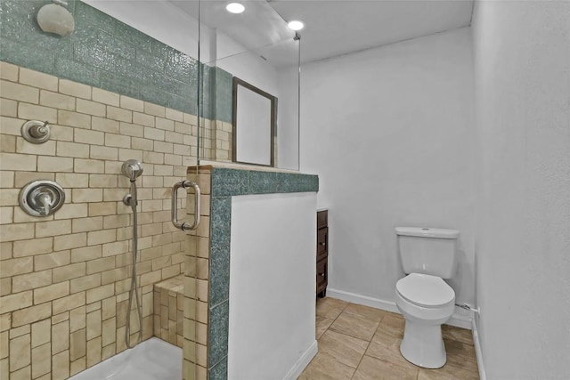 122 W Sierra Cir, San Marcos, TX 78666 - bathroom featuring a stall shower, toilet, vanity, baseboards, and tile patterned floors