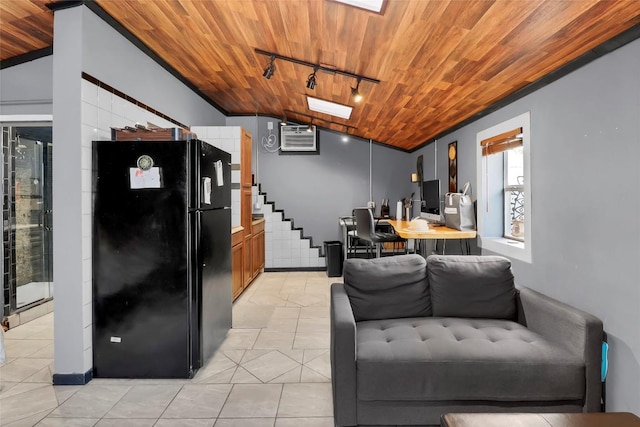 122 W Sierra Cir, San Marcos, TX 78666 - kitchen with freestanding refrigerator, track lighting, wood ceiling, vaulted ceiling, and light tile patterned flooring