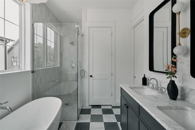 113 Nelray Blvd Unit 1, Austin, TX 78751 - full bath with tile patterned floors, a shower stall, a soaking tub, and double vanity