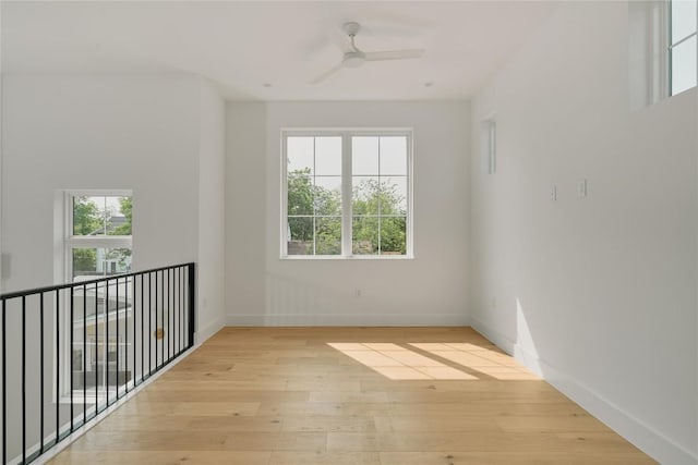 113 Nelray Blvd Unit 1, Austin, TX 78751 - empty room with light wood-type flooring, ceiling fan, and baseboards