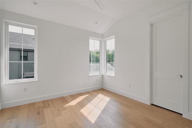 113 Nelray Blvd Unit 1, Austin, TX 78751 - empty room featuring plenty of natural light, lofted ceiling, light wood-style floors, and baseboards