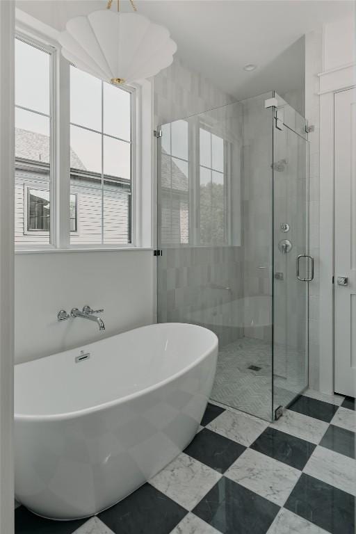 113 Nelray Blvd Unit 1, Austin, TX 78751 - bathroom featuring a stall shower and a soaking tub