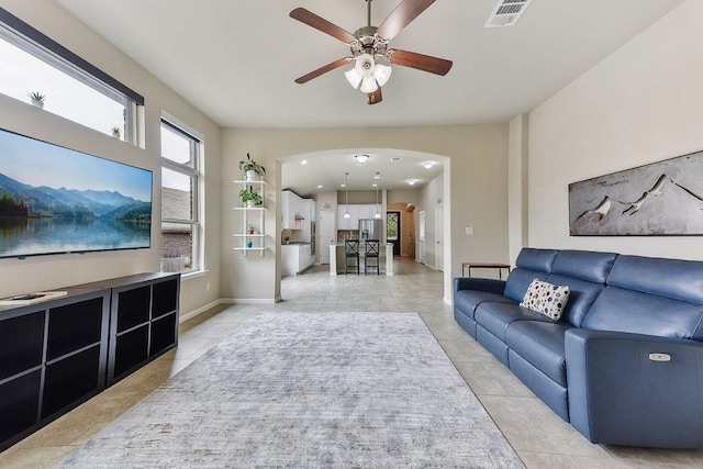 190 Stone View Trl, Austin, TX 78737 - living room with ceiling fan, arched walkways, and light tile patterned floors