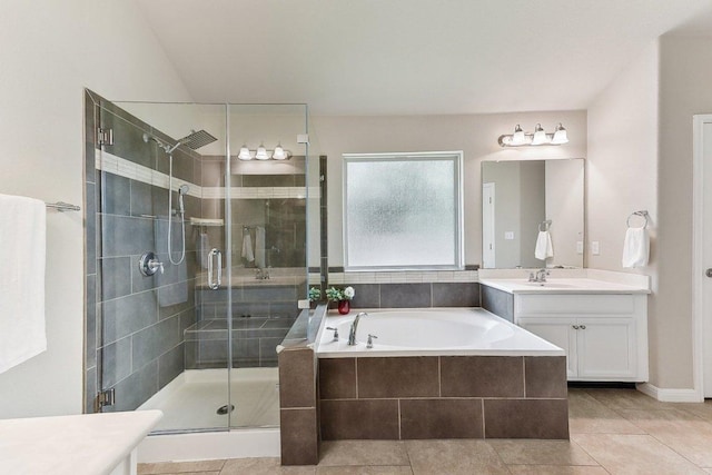 190 Stone View Trl, Austin, TX 78737 - bathroom featuring vanity, a bath, a stall shower, and tile patterned flooring