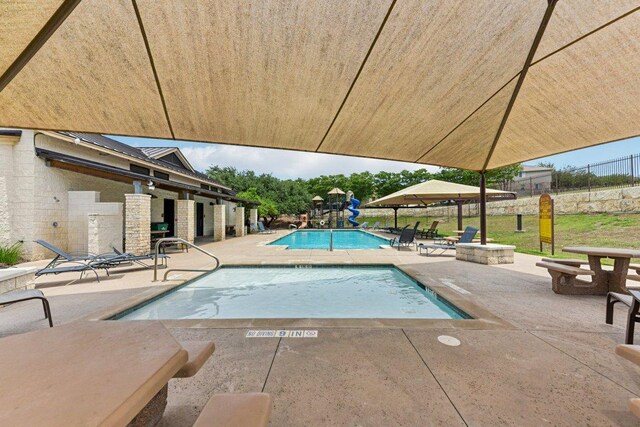 190 Stone View Trl, Austin, TX 78737 - community pool with a patio area and an outdoor fire pit