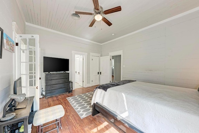 340 Ackerman St, Rockdale, TX 76567 - bedroom featuring wood finished floors, ceiling fan, wooden ceiling, and crown molding