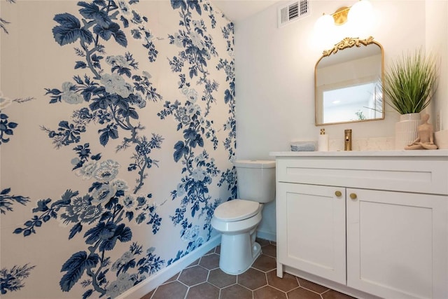 3801 Wilson St, Austin, TX 78704 - bathroom featuring toilet, tile patterned floors, vanity, and baseboards