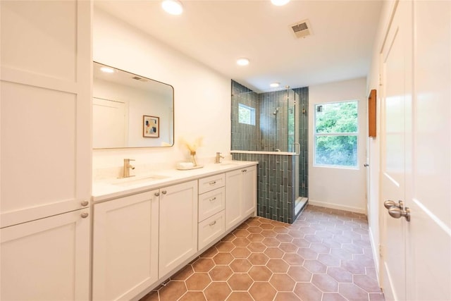 3801 Wilson St, Austin, TX 78704 - bathroom with a stall shower, recessed lighting, double vanity, tile patterned floors, and baseboards