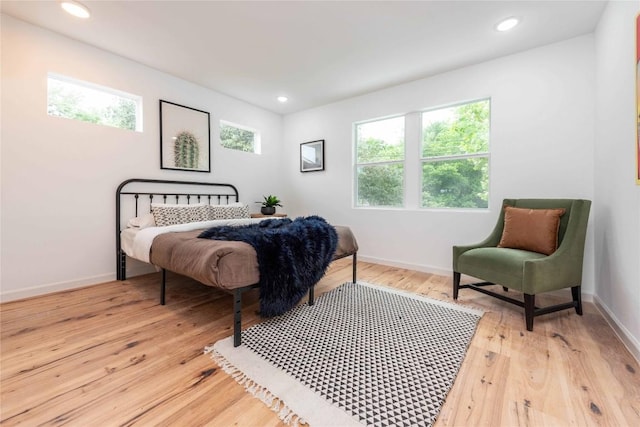 3801 Wilson St, Austin, TX 78704 - bedroom with multiple windows, light wood-style floors, baseboards, and recessed lighting