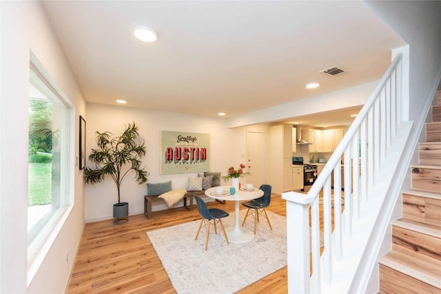 3801 Wilson St, Austin, TX 78704 - dining room featuring stairs, light wood-style flooring, and recessed lighting