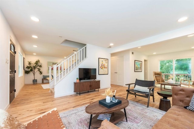 3801 Wilson St, Austin, TX 78704 - living area featuring stairs, light wood-style flooring, and recessed lighting
