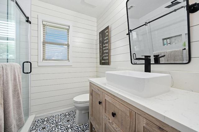 1011 County Road 149, Georgetown, TX 78626 - bathroom with vanity, a stall shower, wood walls, and tile patterned flooring