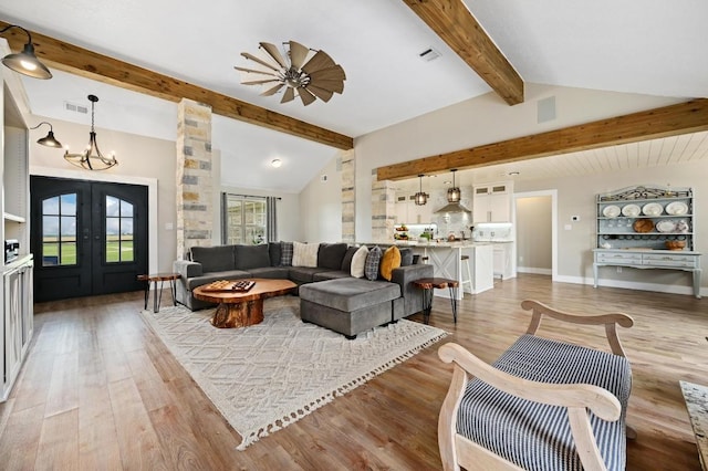 1011 County Road 149, Georgetown, TX 78626 - living area with light wood-style floors, a chandelier, and french doors