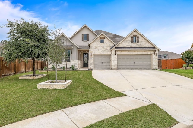 509 Leon Loop, Liberty Hill, TX 78642 - craftsman-style house with stone siding, concrete driveway, stucco siding, and an attached garage