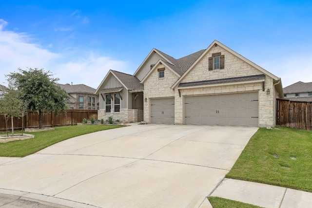 509 Leon Loop, Liberty Hill, TX 78642 - view of front facade with stone siding, driveway, board and batten siding, and roof with shingles