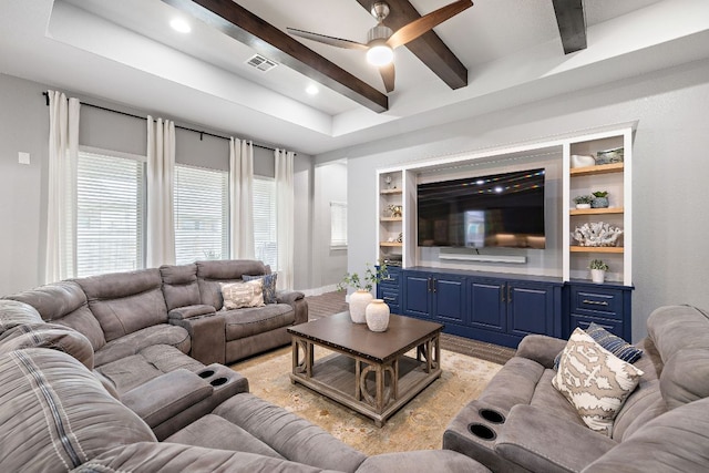 509 Leon Loop, Liberty Hill, TX 78642 - living area with ceiling fan, beam ceiling, light wood-style flooring, built in shelves, and baseboards
