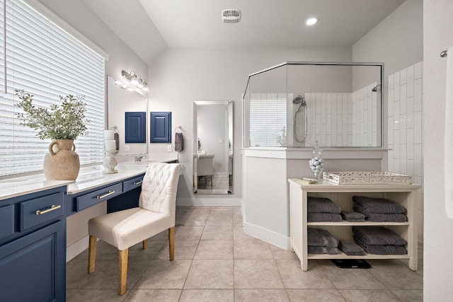 509 Leon Loop, Liberty Hill, TX 78642 - full bathroom with tiled shower, vanity, tile patterned flooring, vaulted ceiling, and recessed lighting