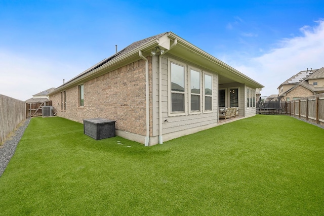 509 Leon Loop, Liberty Hill, TX 78642 - rear view of property featuring cooling unit and brick siding