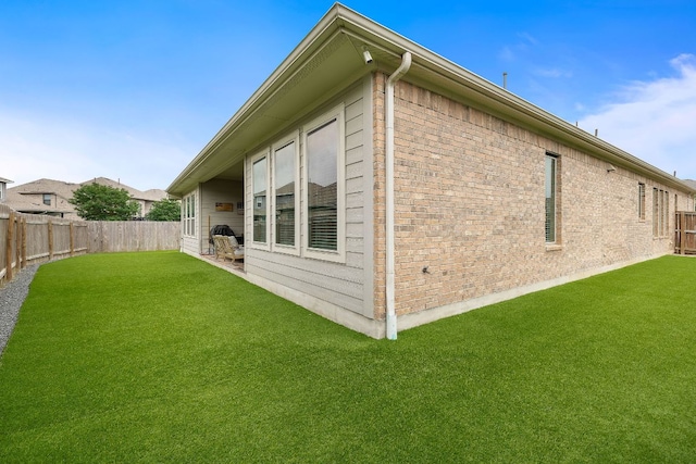 509 Leon Loop, Liberty Hill, TX 78642 - view of side of home featuring brick siding