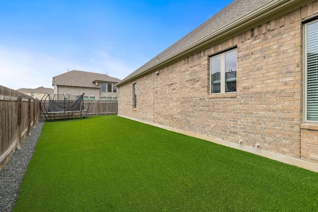 509 Leon Loop, Liberty Hill, TX 78642 - view of yard featuring a trampoline