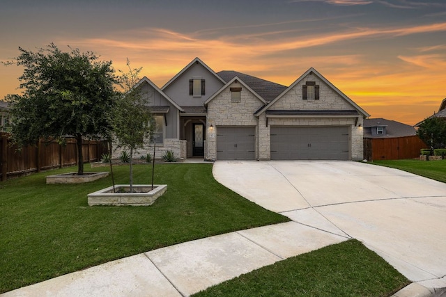 509 Leon Loop, Liberty Hill, TX 78642 - view of front of property featuring stone siding, concrete driveway, and an attached garage