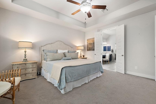 509 Leon Loop, Liberty Hill, TX 78642 - bedroom featuring carpet flooring, baseboards, ceiling fan, and a raised ceiling