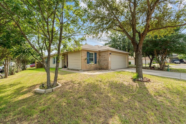101 Texas Ash Cv, Manchaca, TX 78652 - view of front of property with an attached garage, driveway, a front lawn, and brick siding