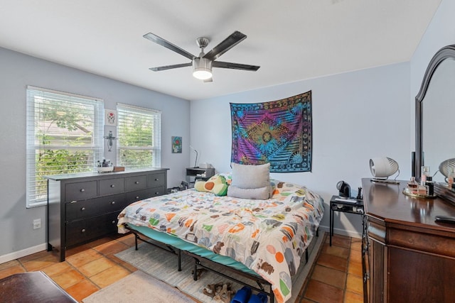 101 Texas Ash Cv, Manchaca, TX 78652 - bedroom with baseboards, light tile patterned floors, and a ceiling fan