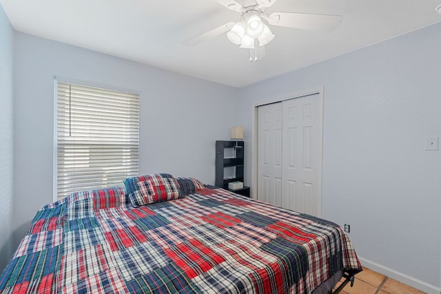 101 Texas Ash Cv, Manchaca, TX 78652 - bedroom featuring a closet, light tile patterned floors, baseboards, and a ceiling fan