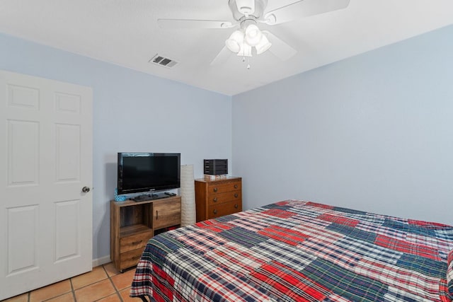 101 Texas Ash Cv, Manchaca, TX 78652 - bedroom with light tile patterned floors and ceiling fan
