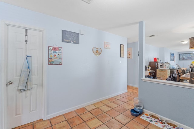 101 Texas Ash Cv, Manchaca, TX 78652 - hallway with light tile patterned flooring and baseboards