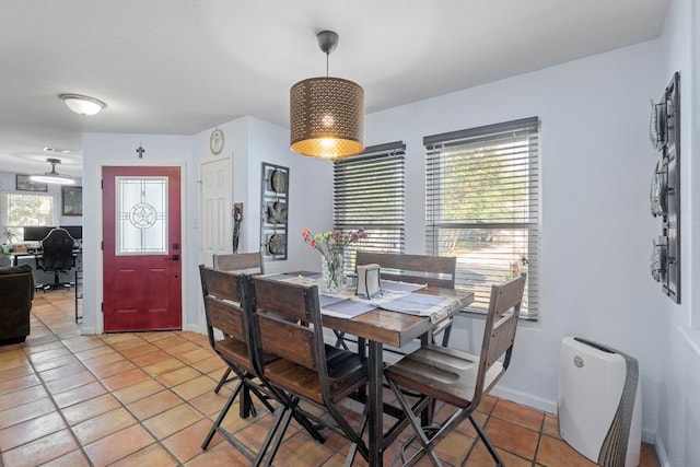 101 Texas Ash Cv, Manchaca, TX 78652 - dining room featuring light tile patterned floors, baseboards, and an office area