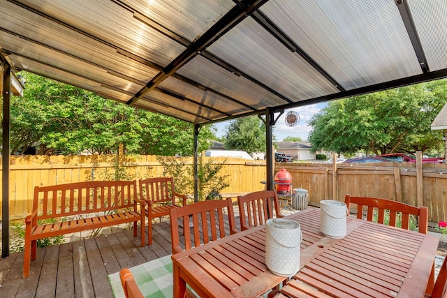 101 Texas Ash Cv, Manchaca, TX 78652 - wooden terrace with outdoor dining area and a fenced backyard