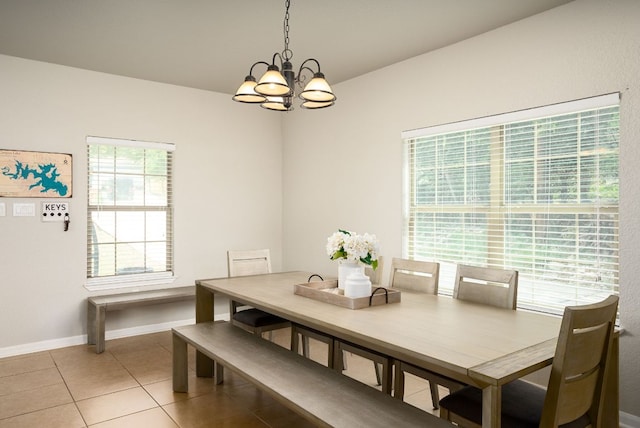 1526 Bonnyview Dr, Canyon Lake, TX 78133 - dining area with a chandelier, baseboards, and light tile patterned flooring