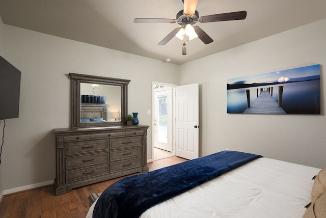 1526 Bonnyview Dr, Canyon Lake, TX 78133 - bedroom featuring wood finished floors, baseboards, and a ceiling fan