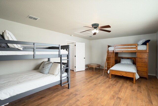 1526 Bonnyview Dr, Canyon Lake, TX 78133 - bedroom featuring hardwood / wood-style floors, a ceiling fan, and baseboards