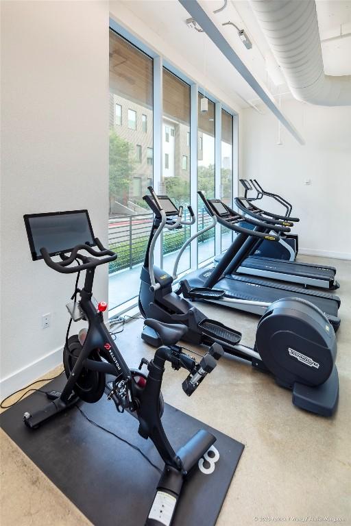 900 S 1st St Unit 416, Austin, TX 78704 - workout area featuring baseboards