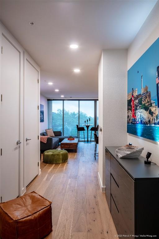900 S 1st St Unit 416, Austin, TX 78704 - corridor featuring light wood-style flooring, recessed lighting, and floor to ceiling windows