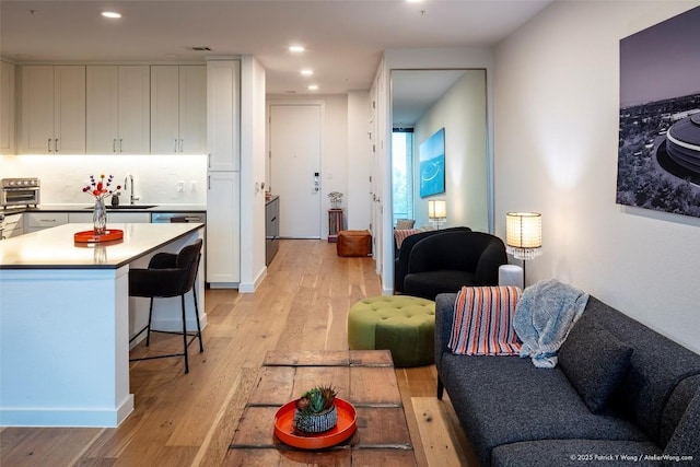 900 S 1st St Unit 416, Austin, TX 78704 - living room with light wood-style floors and recessed lighting