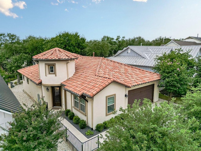 213 Sowing Oak Dr, San Marcos, TX 78666 - mediterranean / spanish home with an attached garage, stucco siding, and a tile roof