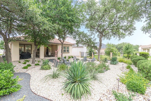213 Sowing Oak Dr, San Marcos, TX 78666 - rear view of property with a patio area, a tile roof, and stucco siding