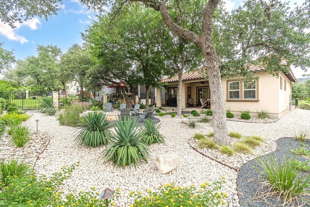 213 Sowing Oak Dr, San Marcos, TX 78666 - back of property featuring stucco siding and a tiled roof