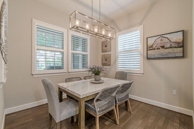 213 Sowing Oak Dr, San Marcos, TX 78666 - dining room with a chandelier, baseboards, and dark wood-type flooring