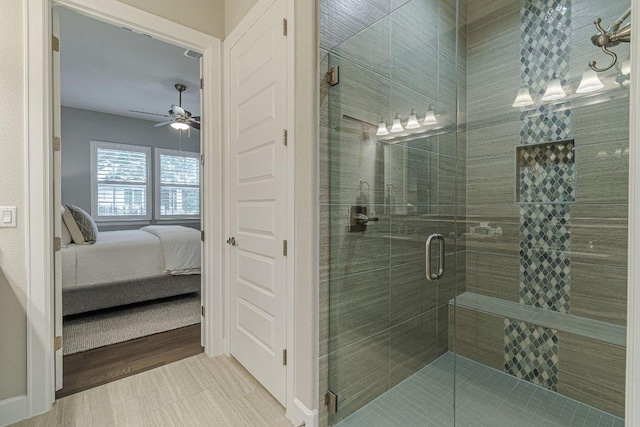 213 Sowing Oak Dr, San Marcos, TX 78666 - ensuite bathroom with ceiling fan, a shower stall, and tile patterned flooring