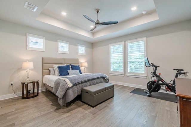 433 Skipping Cedar St, San Marcos, TX 78666 - bedroom with a raised ceiling, light wood-type flooring, baseboards, recessed lighting, and ceiling fan
