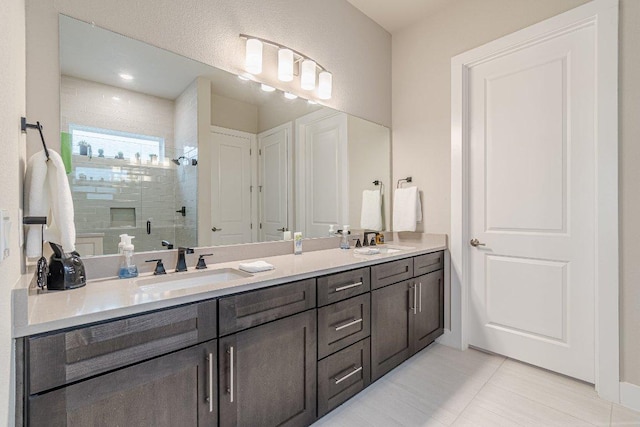 433 Skipping Cedar St, San Marcos, TX 78666 - bathroom with a shower stall, double vanity, and tile patterned floors