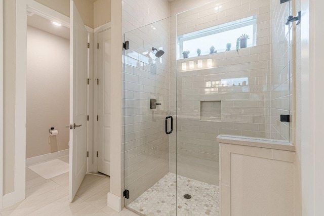 433 Skipping Cedar St, San Marcos, TX 78666 - full bathroom featuring a shower stall, tile patterned floors, and baseboards